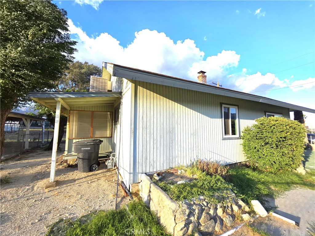 14055 Palm Street Cabazon, CA 92230 - Photo 3 of 22 a front view of a house with a porch