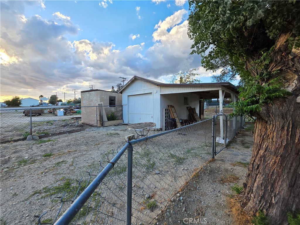 14055 Palm Street Cabazon, CA 92230 - Photo 10 of 22 a view of a house with a sink and backyard