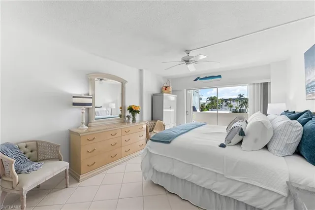 a bedroom with bed and window