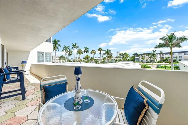 a view of balcony with furniture