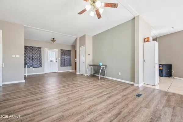 a view of a livingroom with wooden floor