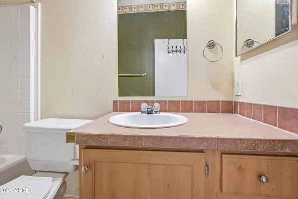 a bed room with furniture and a flat screen tv