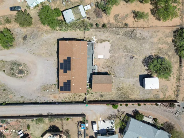 an aerial view of a house with outdoor space