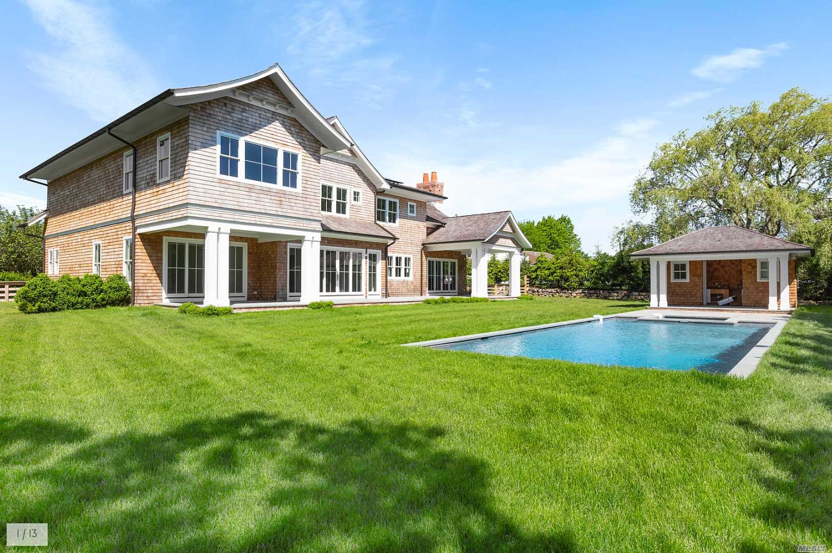 32 South Potato Barn Road Water Mill, NY 11976 - Photo 1 of 1 a front view of a house with a yard and trees