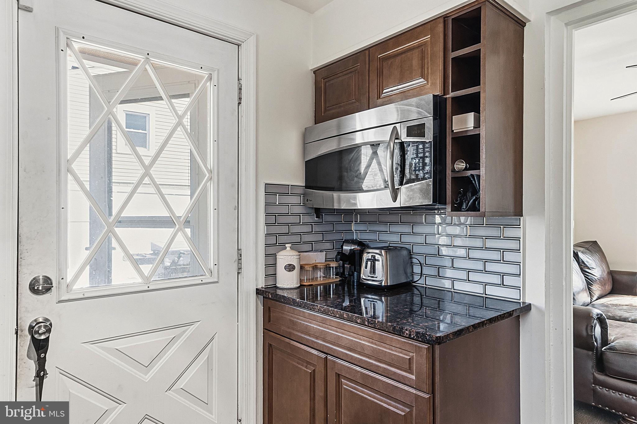 310 Greenwood Road Lansdale, PA 19446 - Photo 12 of 24 a kitchen with stainless steel appliances granite countertop a sink and a microwave