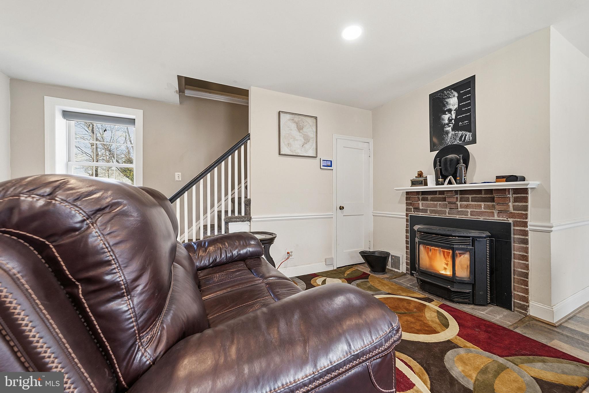 310 Greenwood Road Lansdale, PA 19446 - Photo 5 of 24 a living room with furniture and a fireplace