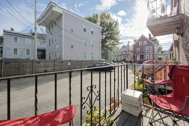 a view of a balcony with chairs