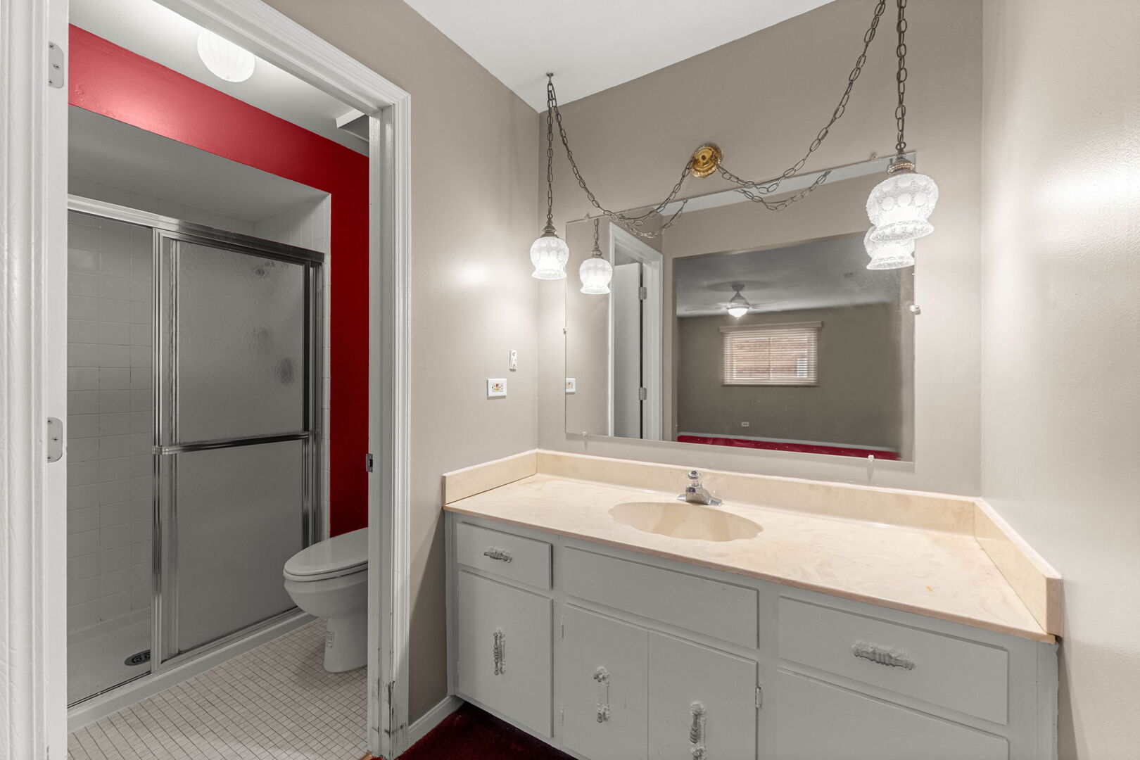 9122 South Pulaski Road, Unit 2E Oak Lawn, IL 60453 - Photo 11 of 16 a bathroom with a sink a toilet and a large mirror
