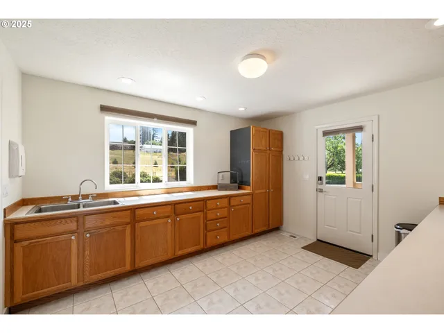 a large bathroom with a sink mirror and a bathtub