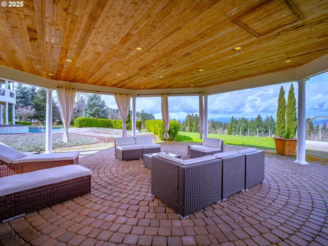 a swimming pool with outdoor seating