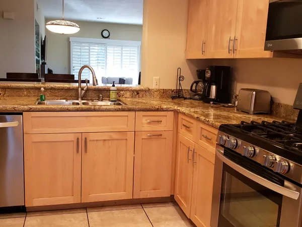 a kitchen with cabinets and appliances