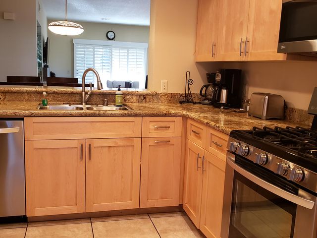 a kitchen with cabinets and appliances