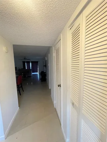 a view of living room with furniture and a window
