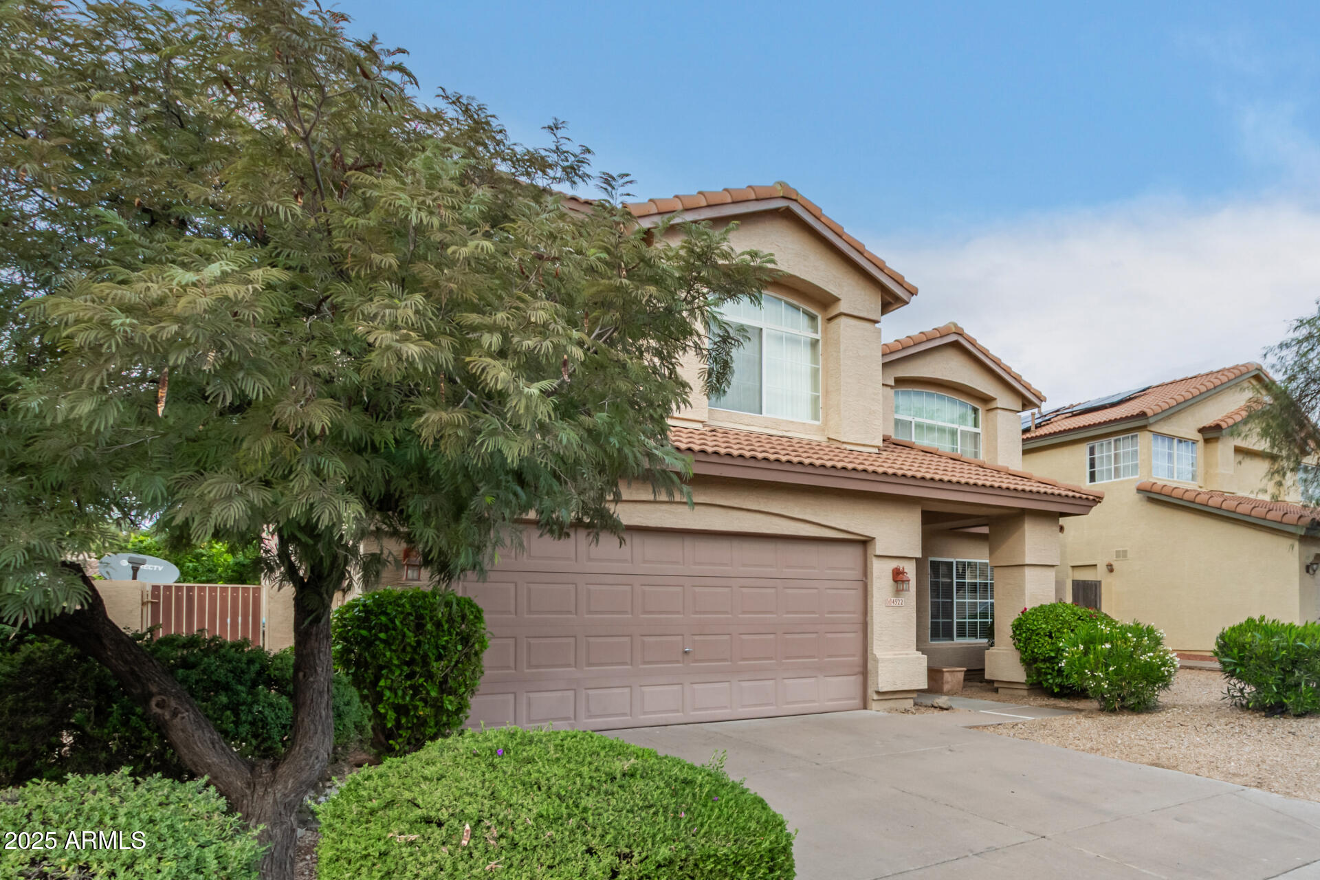 4522 East Rowel Road Phoenix, AZ 85050 - Photo 54 of 61 front view of a house with a street