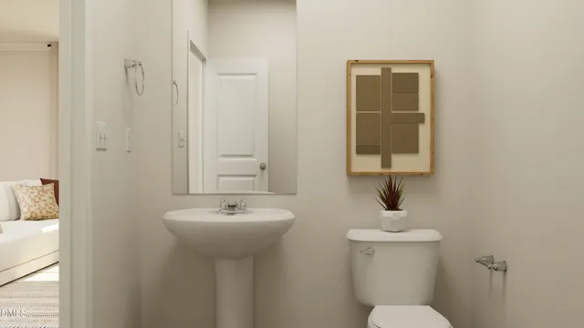 a dining room with furniture and a potted plant