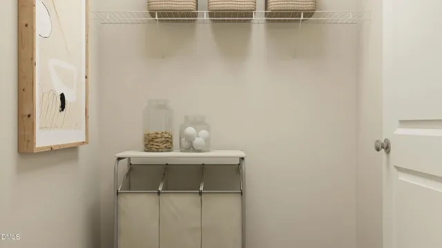 a kitchen with stainless steel appliances white cabinets and wooden floor