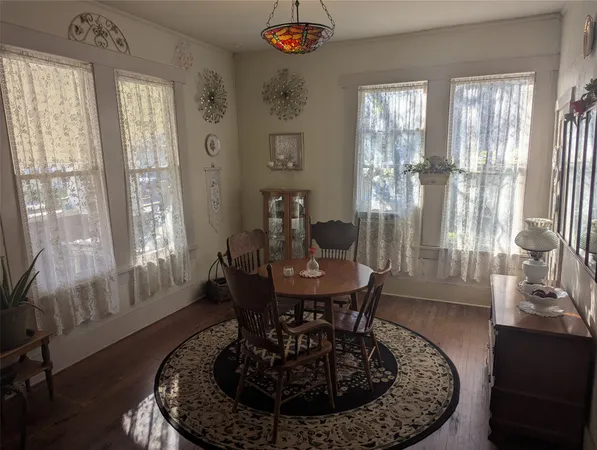 a living room with hard wood flooring and a couch