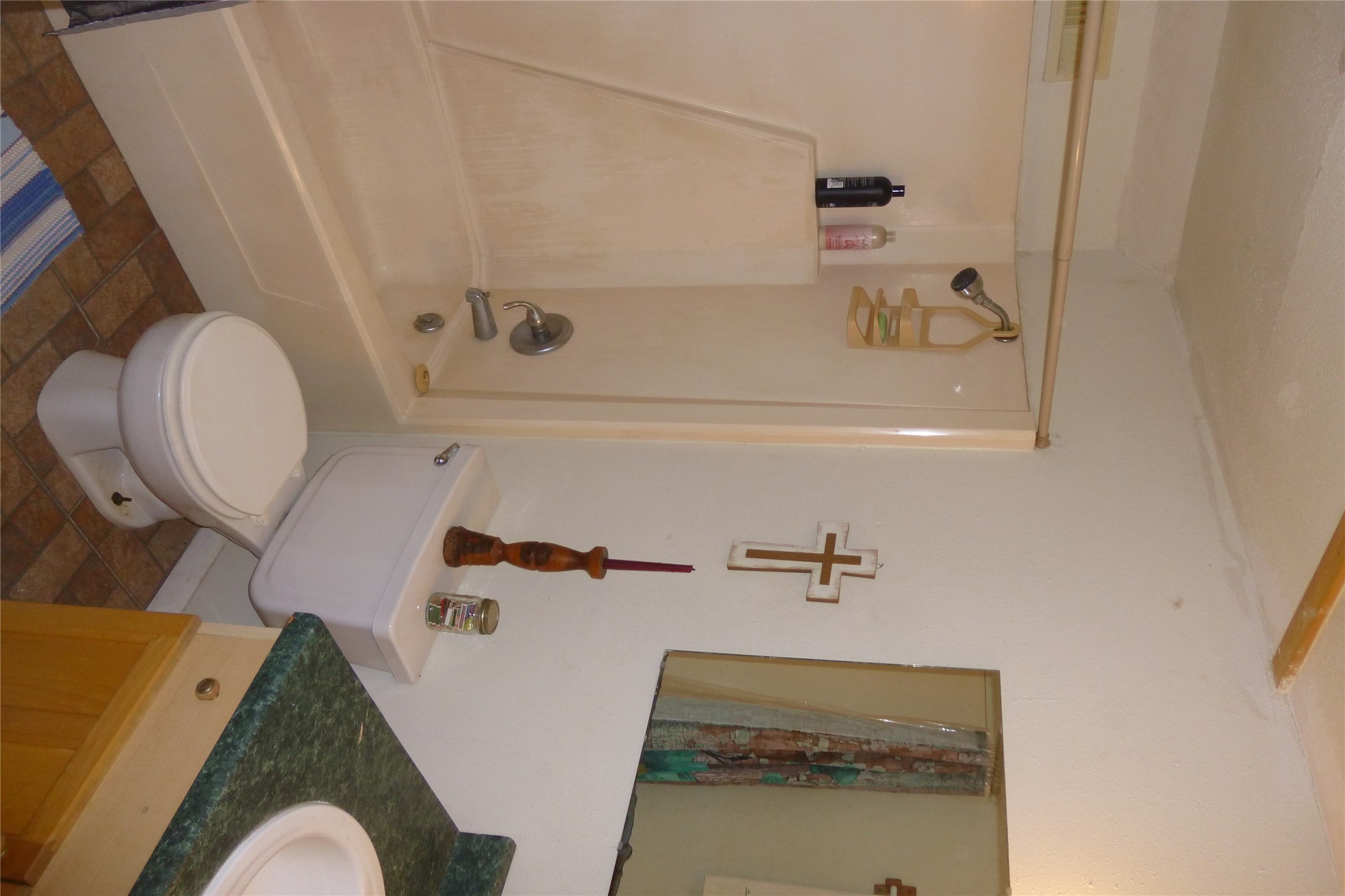 502 West 10th Street Taylor, TX 76574 - Photo 29 of 34 a bathroom with a sink toilet and shower