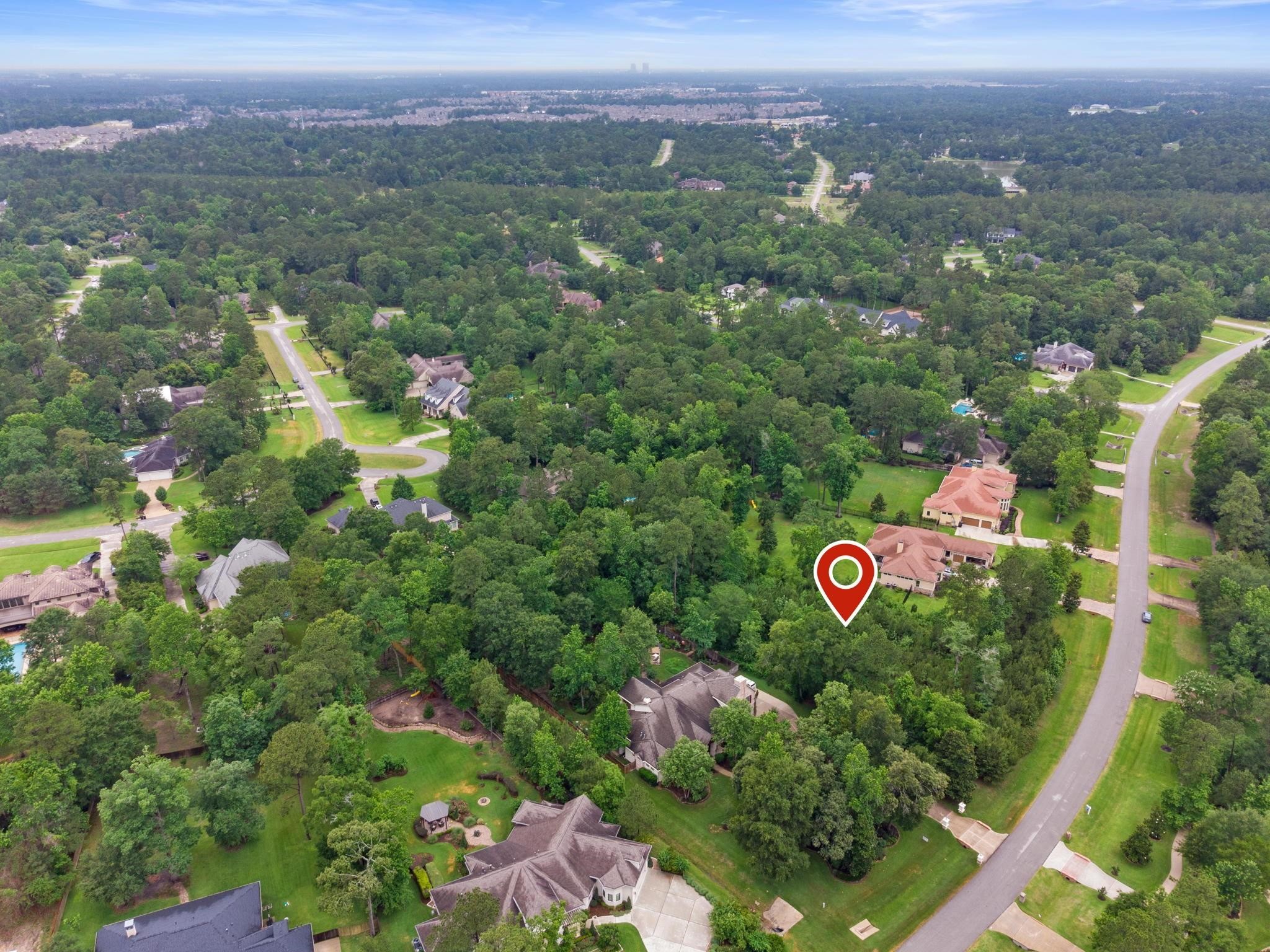 27403 Whispering Maple Way Spring, TX 77386 - Photo 10 of 10 Discover a serene oasis with this exclusive property, nestled in a lush, green neighborhood of spacious homes and mature trees, offering privacy, natural beauty, and well-maintained roads for the tranquil lifestyle you’ve been seeking.