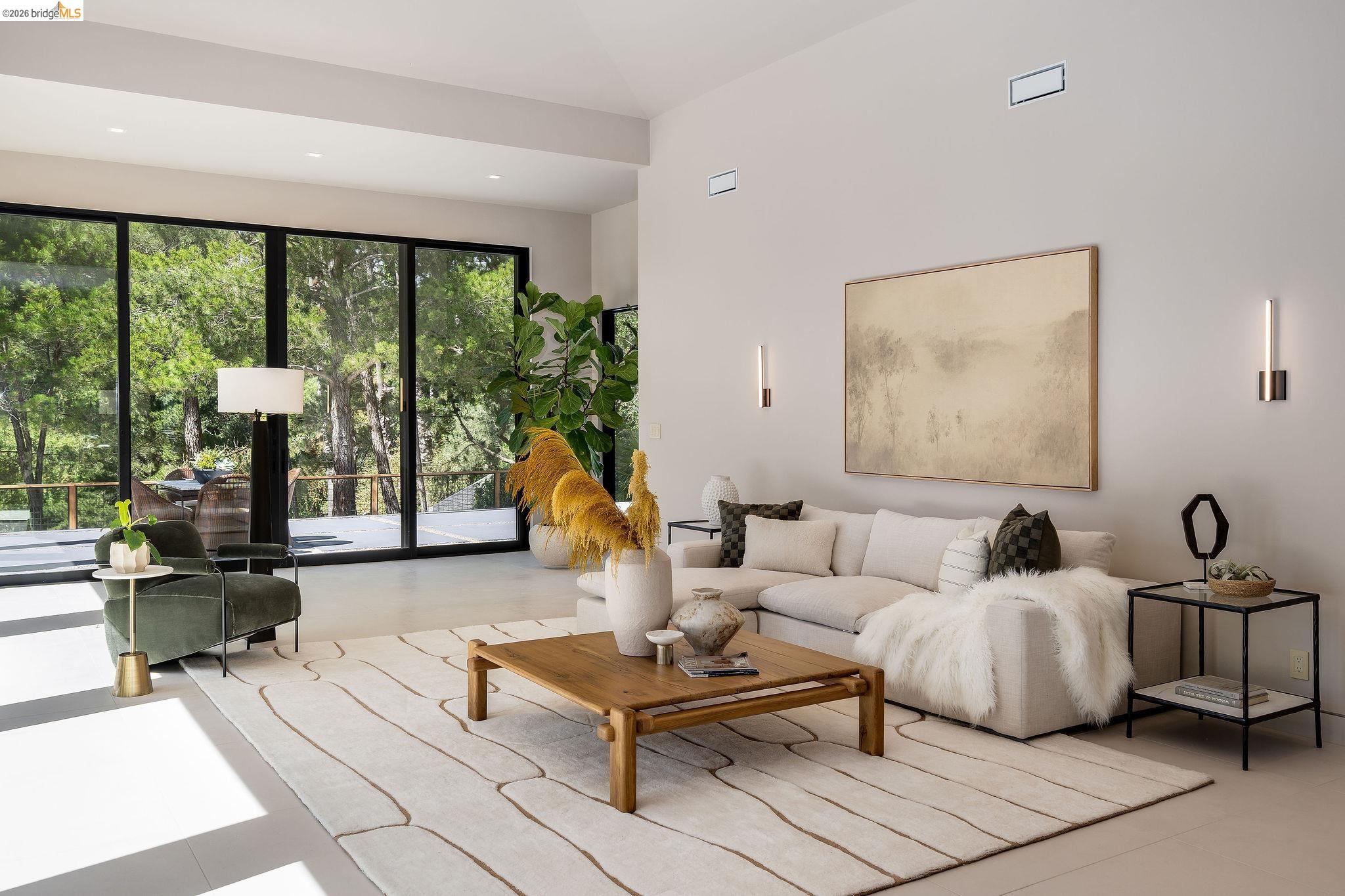 5645 Bacon Road Oakland, CA 94619 - Photo 15 of 94 Spacious interior featuring floor-to-ceiling windows, high ceilings, recessed lighting, and wall-mounted sconces