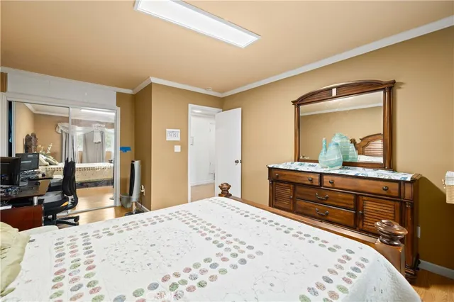 a bedroom with a bed and a dresser