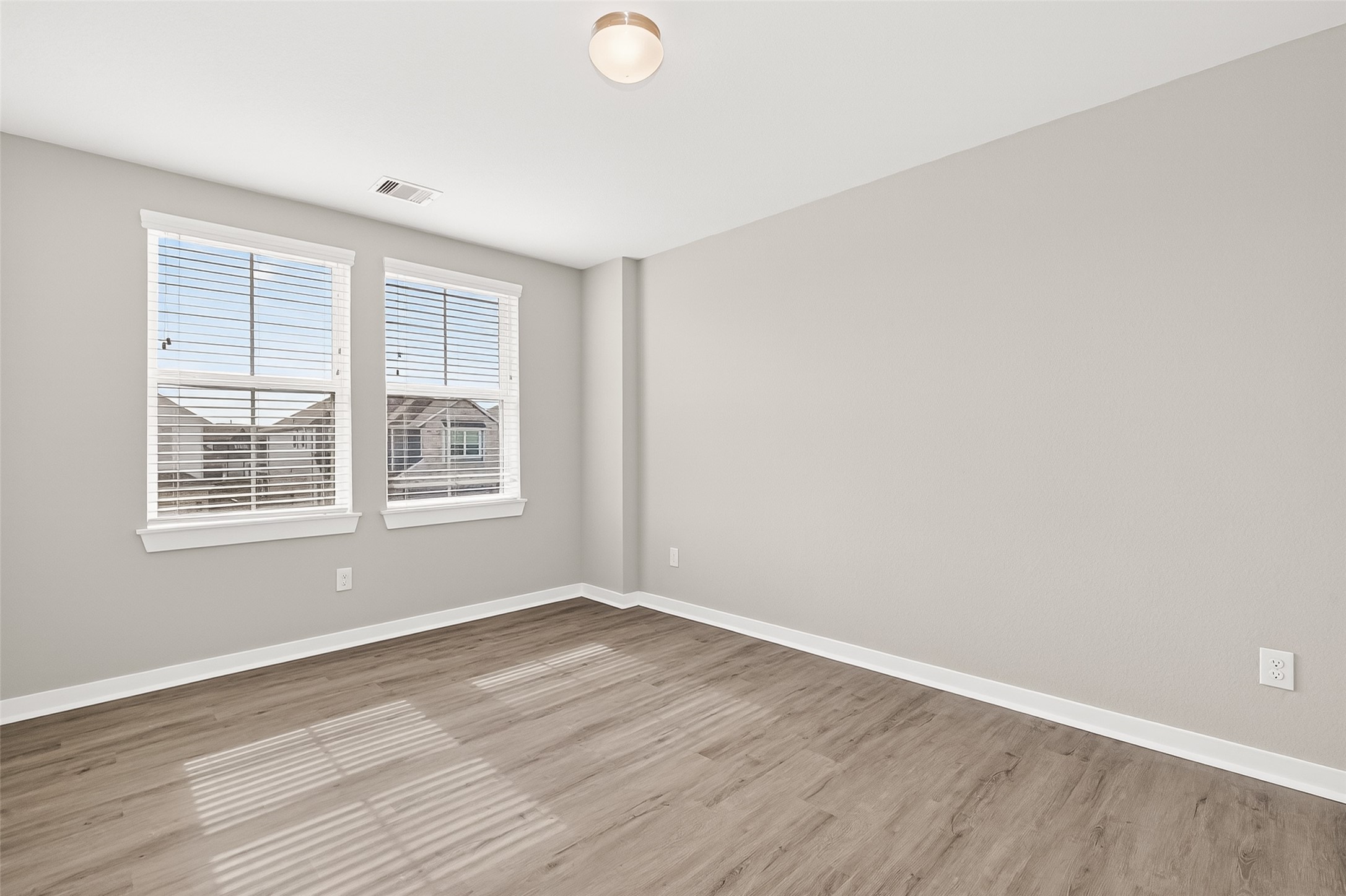 2142 Reed Cave Lane Spring, TX 77386 - Photo 32 of 50 wooden floor in an empty room with a window