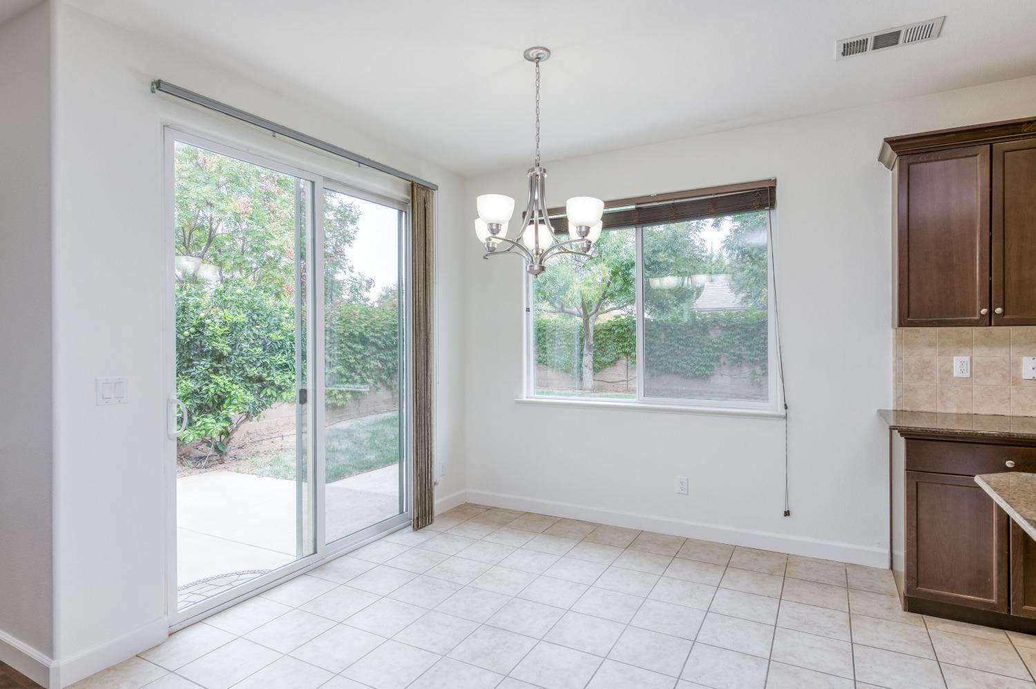 1697 North Connery Lane Clovis, CA 93619 - Photo 13 of 56 a view of livingroom with furniture wooden floor and windows
