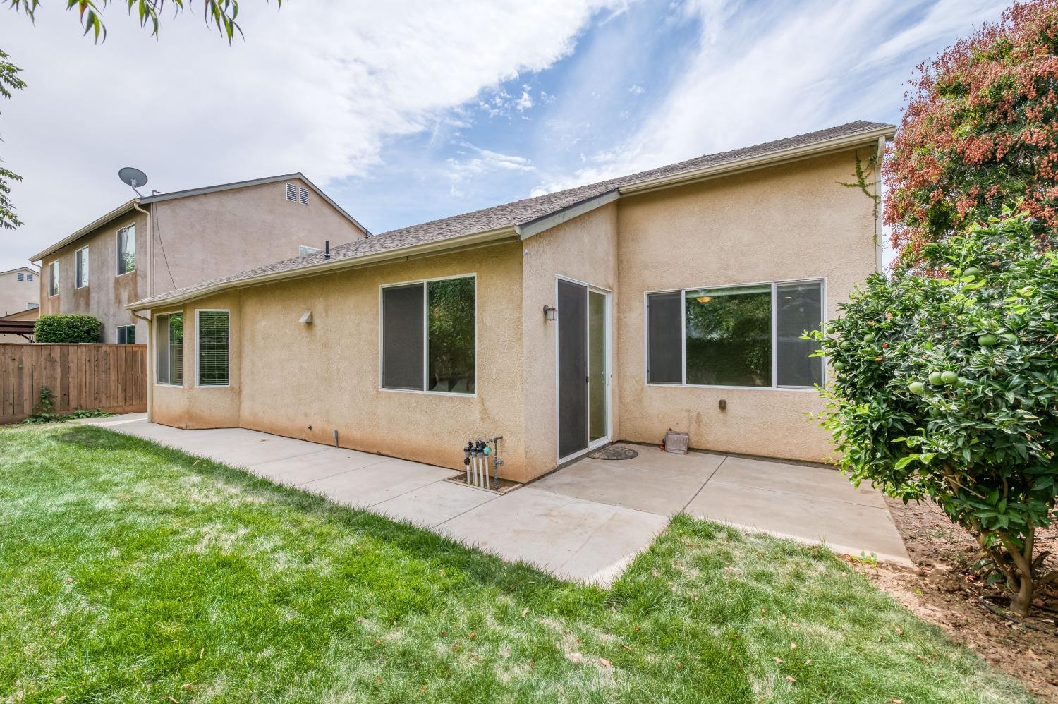 1697 North Connery Lane Clovis, CA 93619 - Photo 33 of 56 a view of a house with a yard
