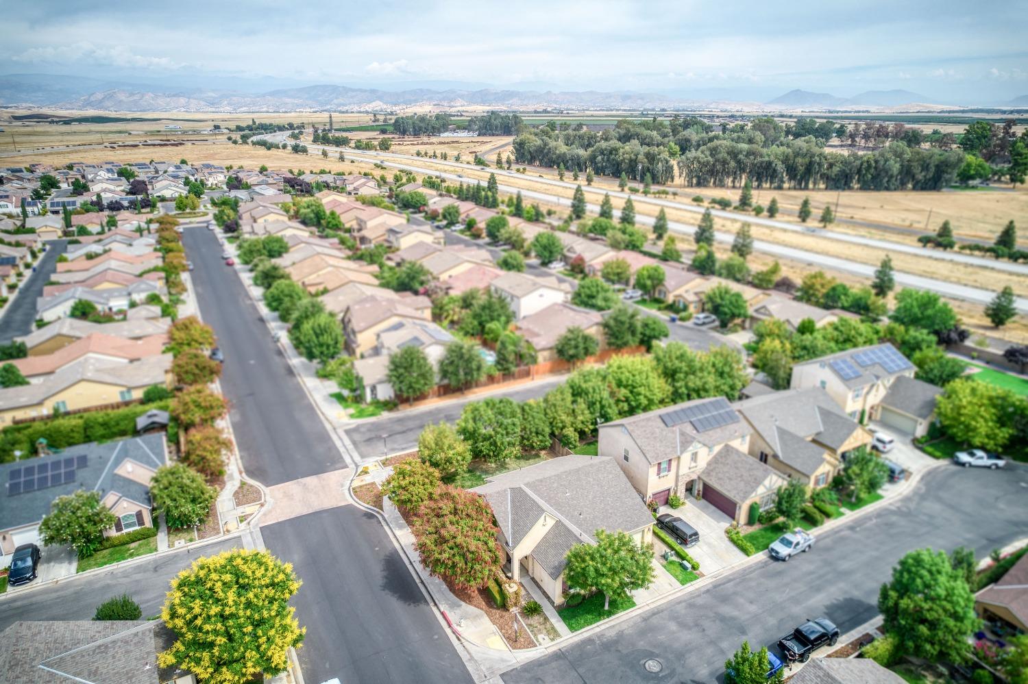 1697 North Connery Lane Clovis, CA 93619 - Photo 34 of 56 an aerial view of residential building and lake view