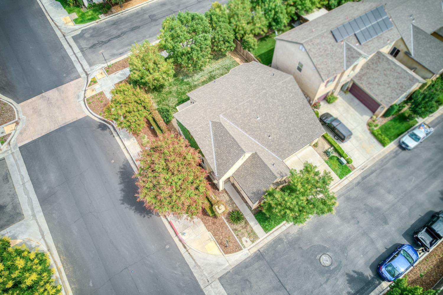 1697 North Connery Lane Clovis, CA 93619 - Photo 35 of 56 an aerial view of a house with a yard and a garden