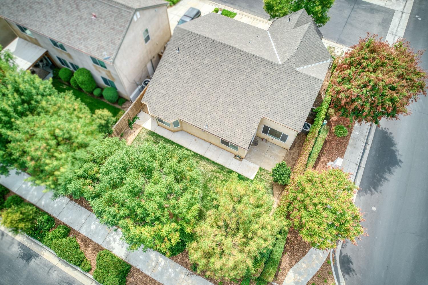 1697 North Connery Lane Clovis, CA 93619 - Photo 40 of 56 an aerial view of a house with a yard and garden