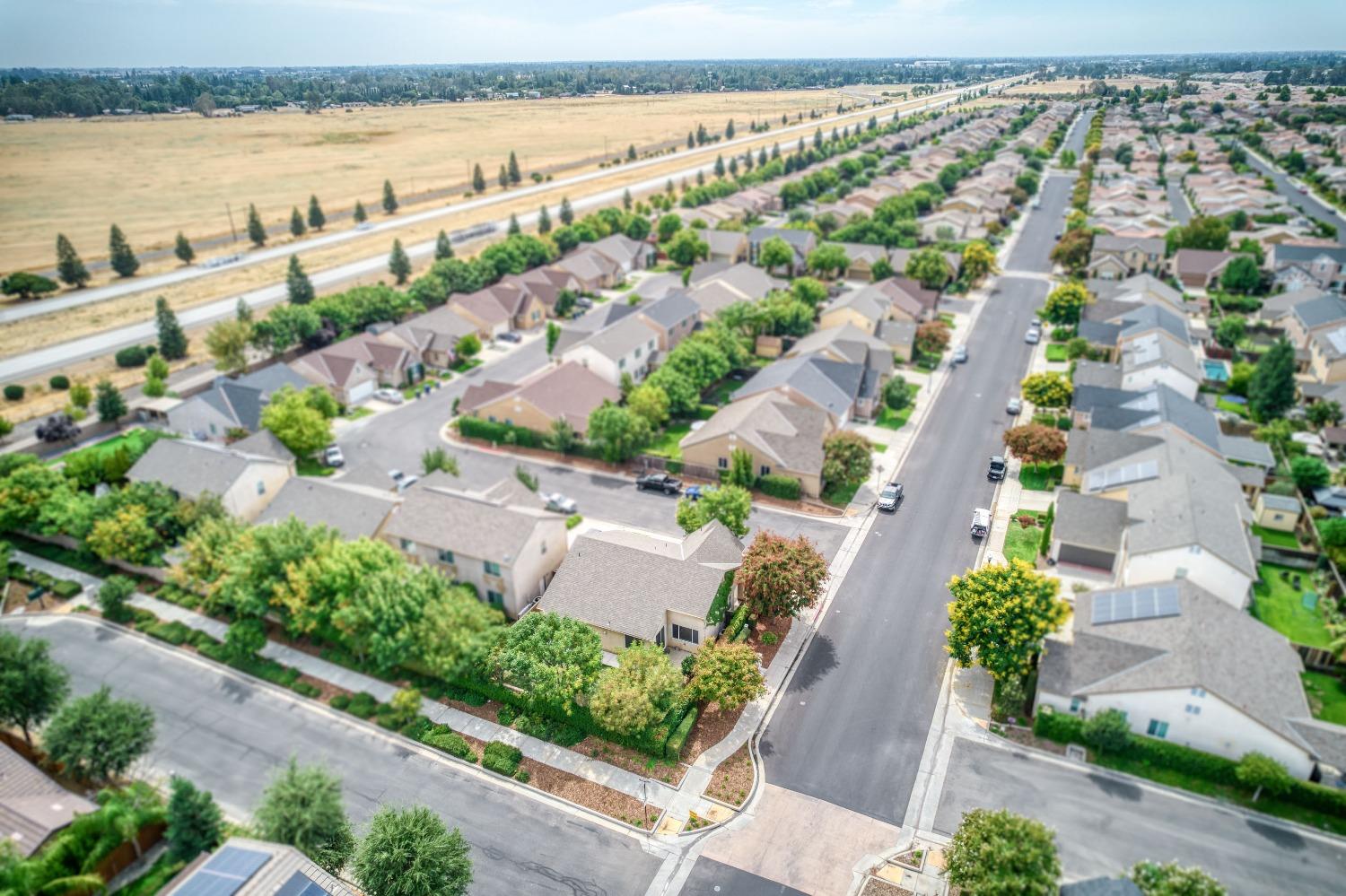 1697 North Connery Lane Clovis, CA 93619 - Photo 41 of 56 an aerial view of a city with lake view