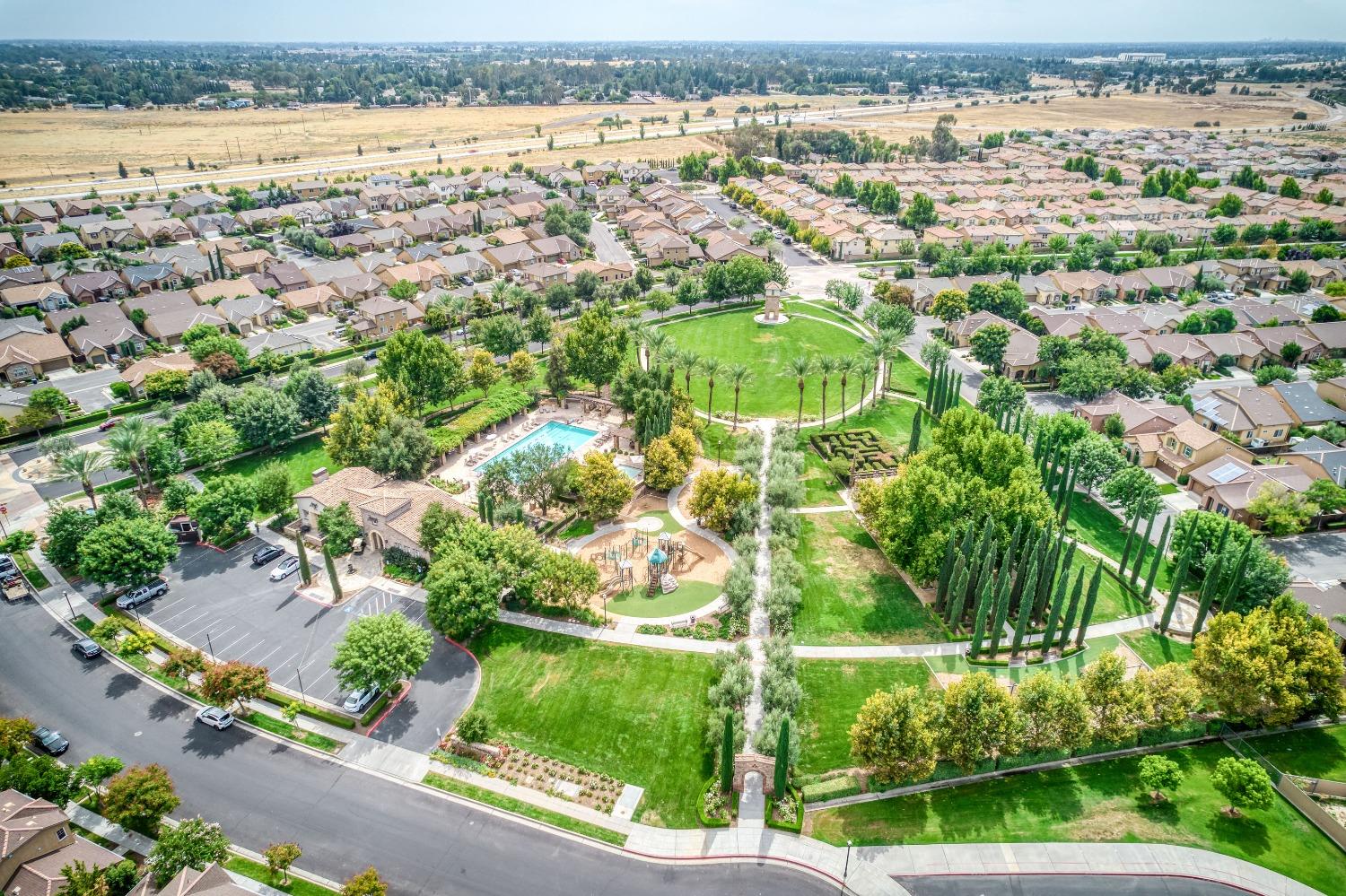 1697 North Connery Lane Clovis, CA 93619 - Photo 43 of 56 an aerial view of residential houses with outdoor space and trees