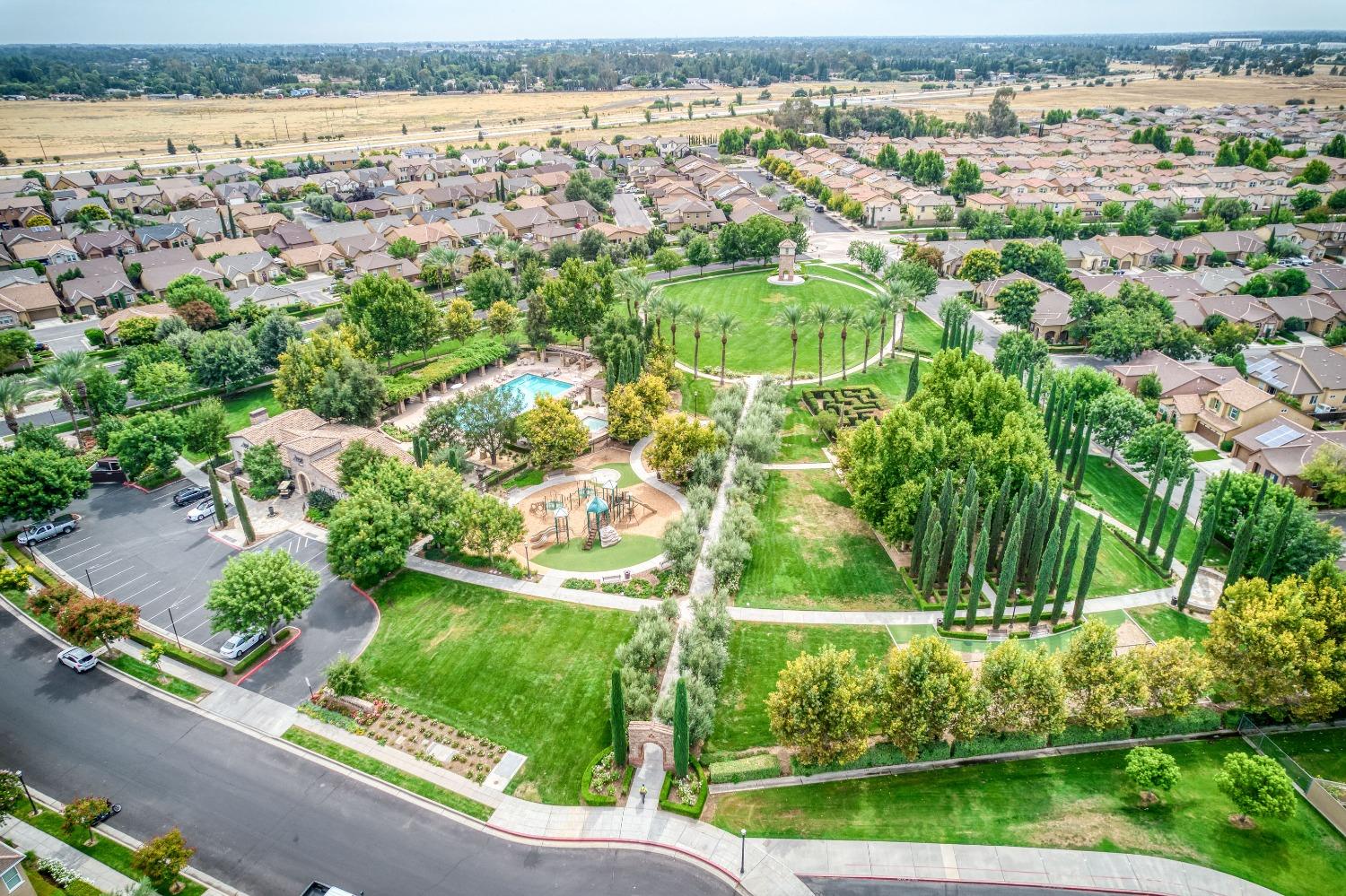 1697 North Connery Lane Clovis, CA 93619 - Photo 44 of 56 an aerial view of residential houses with outdoor space and trees