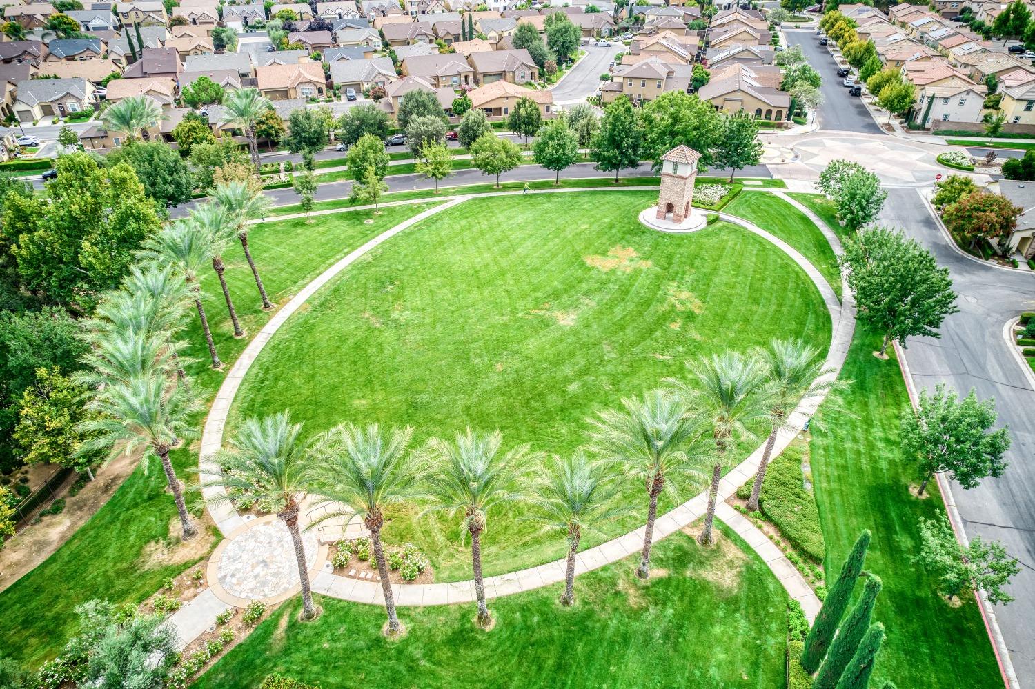 1697 North Connery Lane Clovis, CA 93619 - Photo 45 of 56 a view of a golf course with a lake