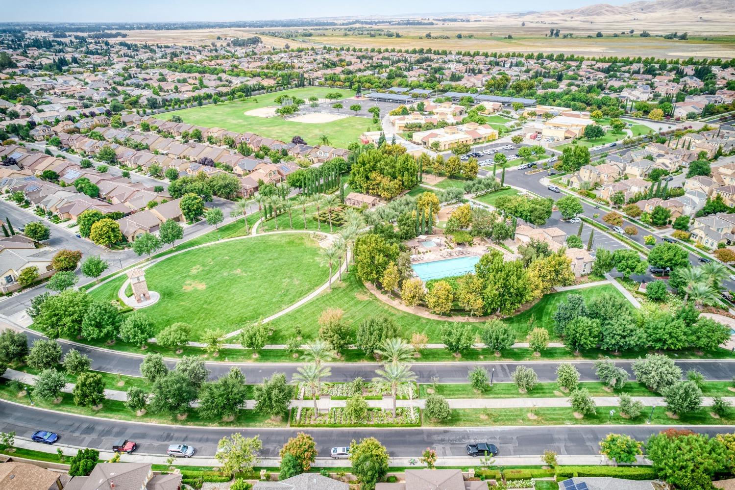1697 North Connery Lane Clovis, CA 93619 - Photo 47 of 56 an aerial view of residential houses with outdoor space and trees