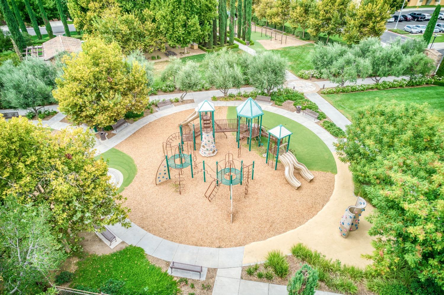 1697 North Connery Lane Clovis, CA 93619 - Photo 6 of 56 a view of a swimming pool with a yard and outdoor seating