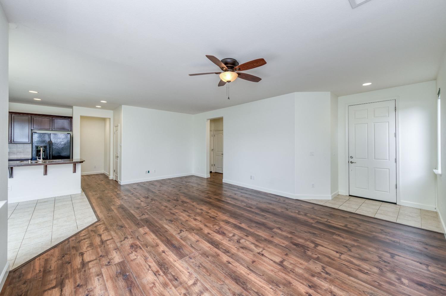 1697 North Connery Lane Clovis, CA 93619 - Photo 9 of 56 a view of a livingroom with a ceiling fan window and hardwood floor
