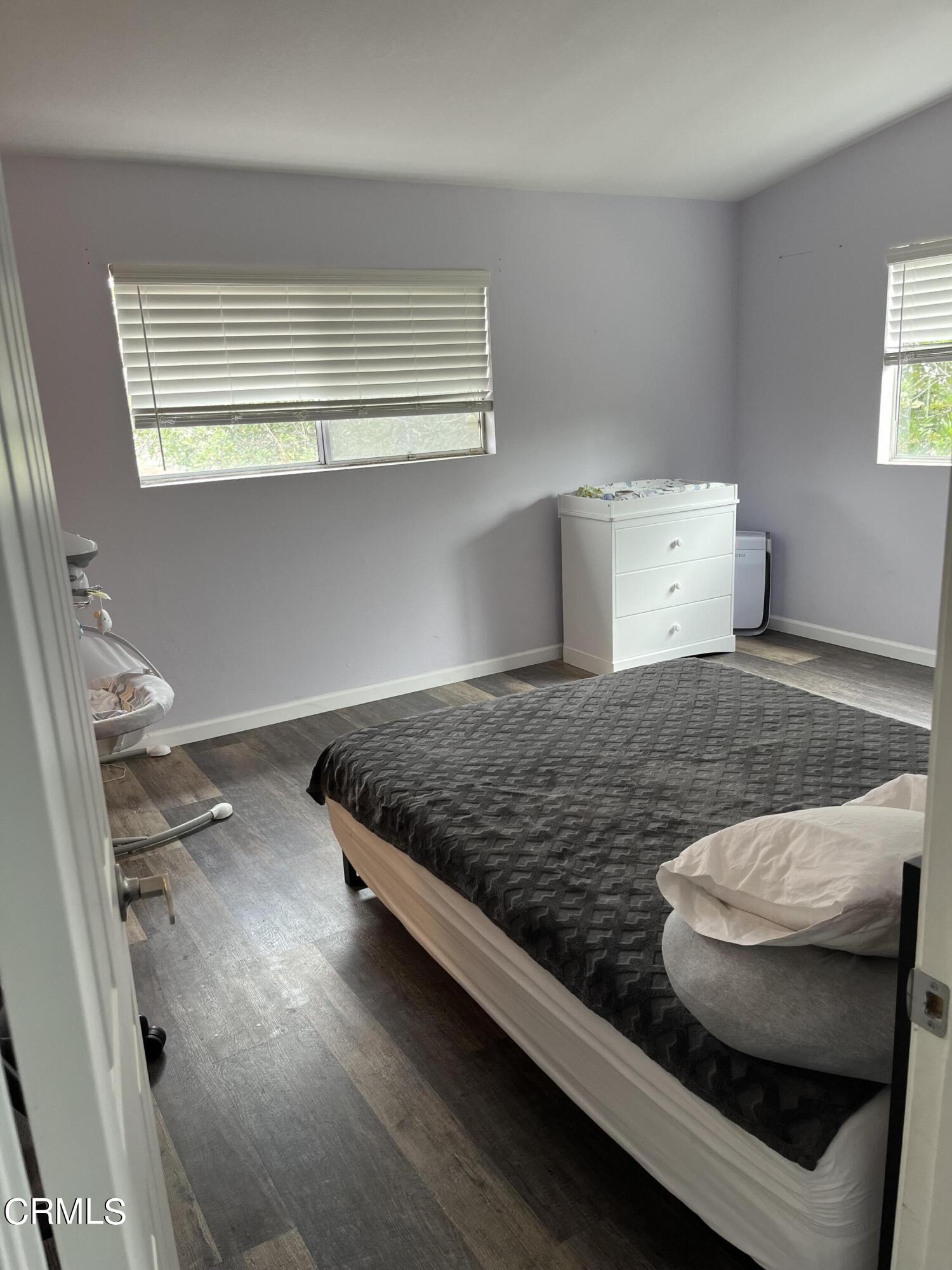 511 East Bard Road, Unit 16 Oxnard, CA 93033 - Photo 12 of 13 a bedroom with a bed and window