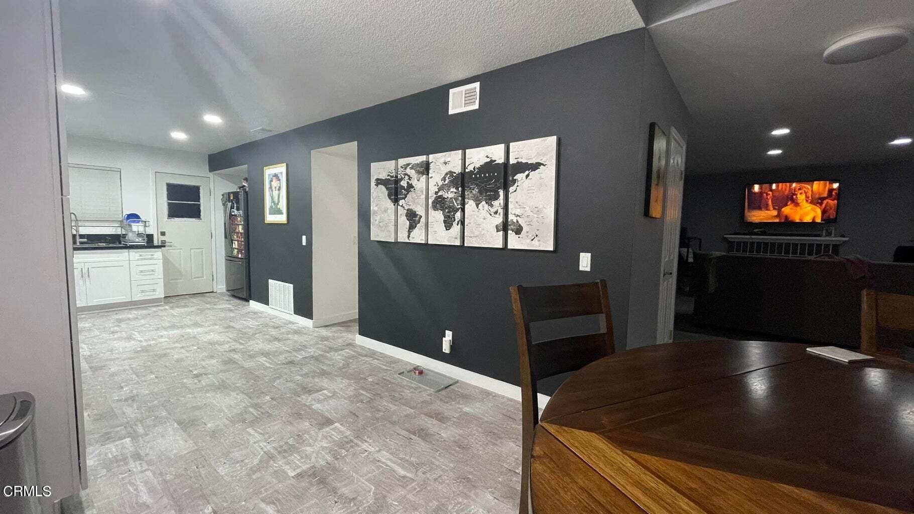 511 East Bard Road, Unit 16 Oxnard, CA 93033 - Photo 6 of 13 a kitchen with stainless steel appliances granite countertop a refrigerator and a stove top oven