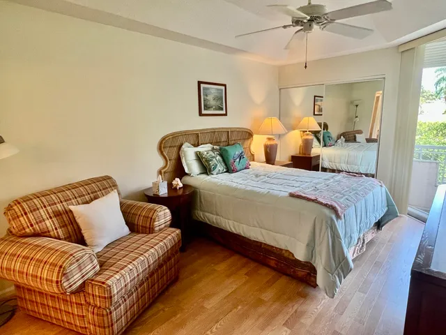 a bedroom with a bed couch and window