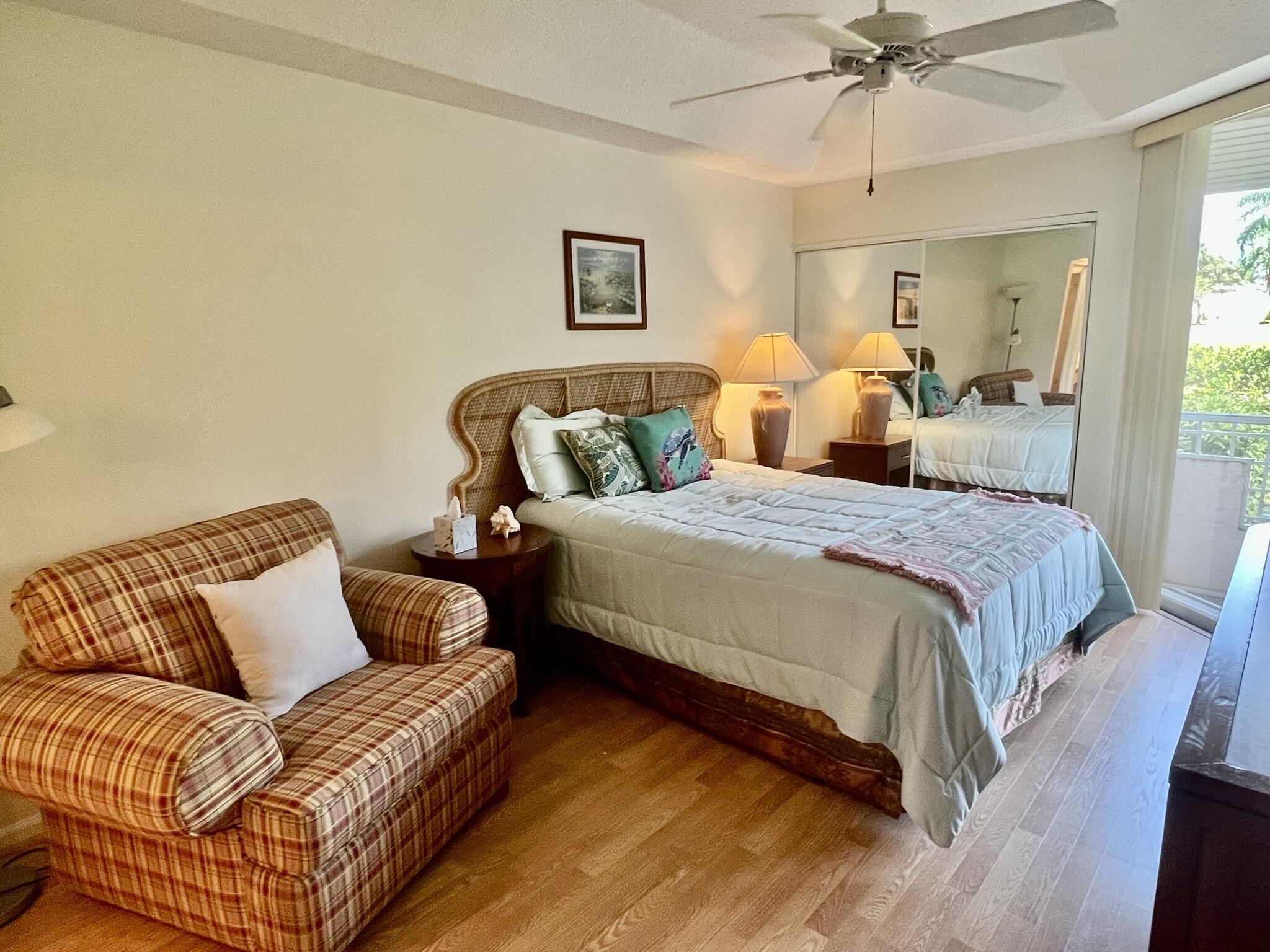 101 Muirfield Court, Unit F Jupiter, FL 33458 - Photo 11 of 20 a bedroom with a bed couch and window