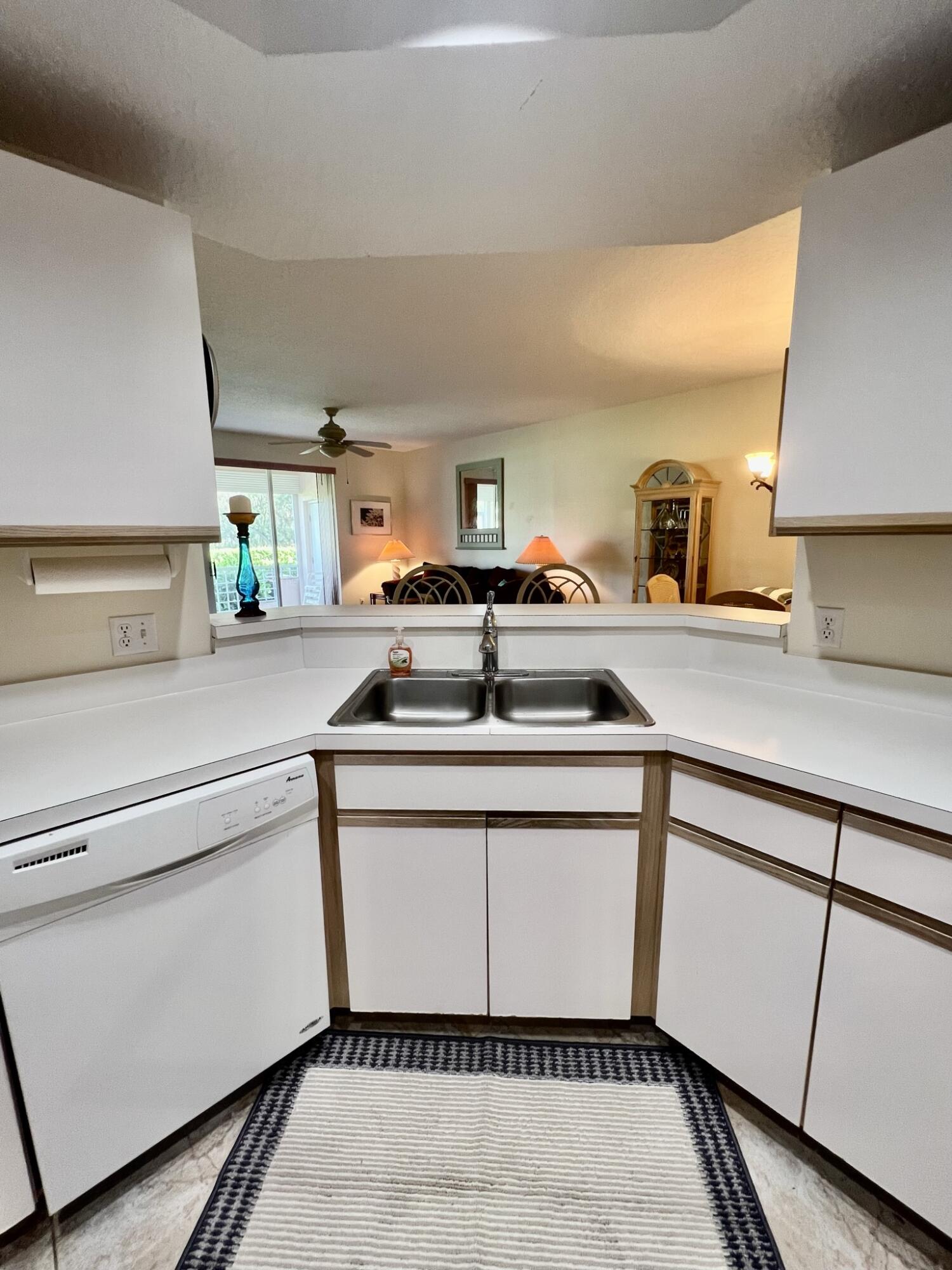 101 Muirfield Court, Unit F Jupiter, FL 33458 - Photo 8 of 20 a utility room with washer and dryer