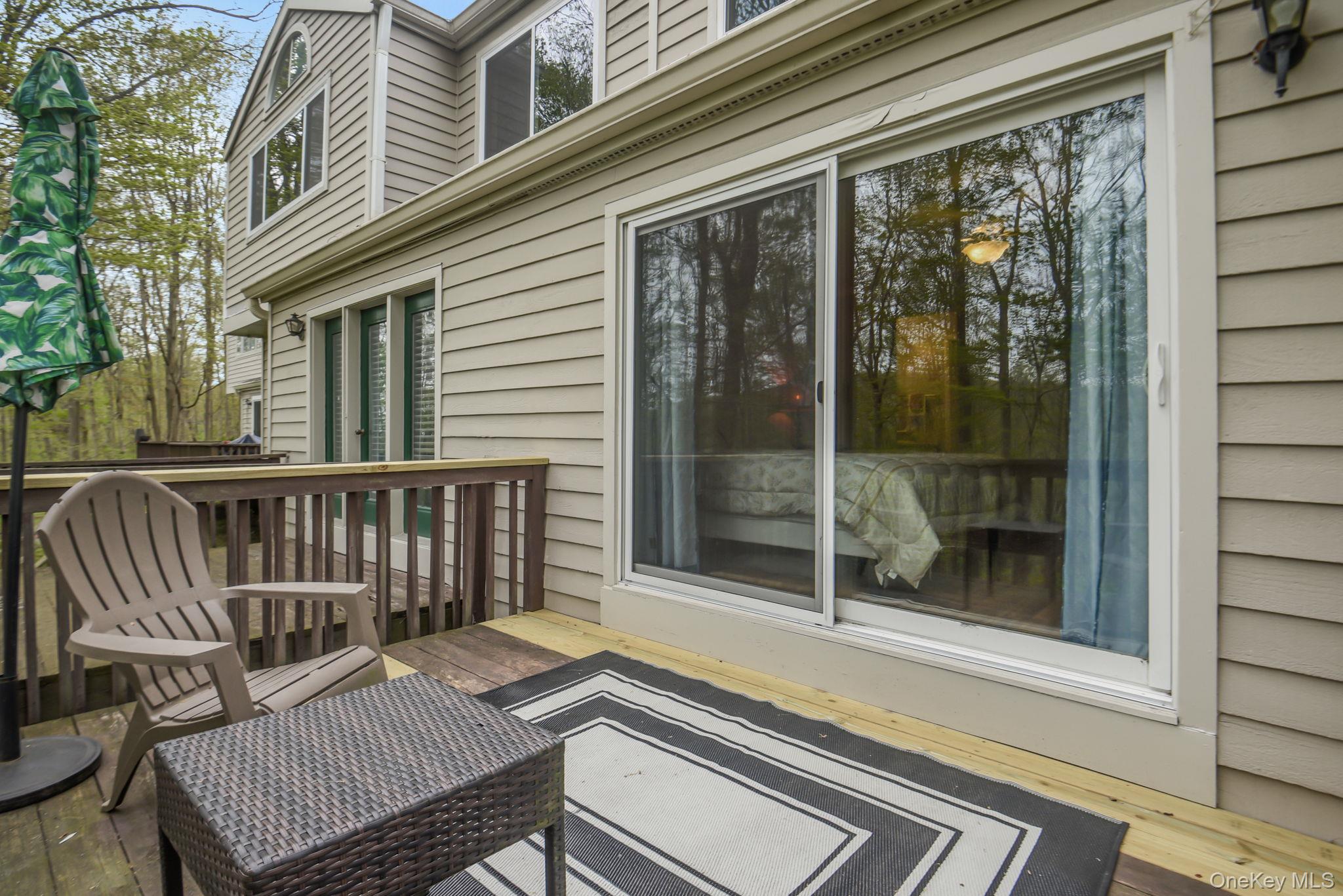 805 Eagles Ridge Road Brewster, NY 10509 - Photo 20 of 22 a view of a chair and table in the balcony