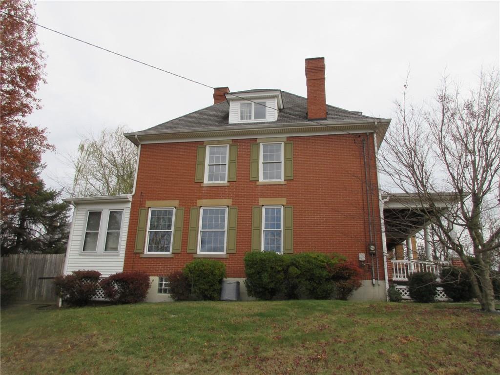 809 Thomas Street Monongahela, PA 15063 - Photo 2 of 11 a front view of a house with a garden