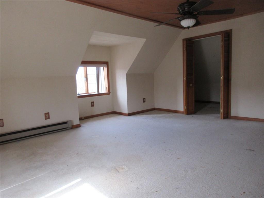 809 Thomas Street Monongahela, PA 15063 - Photo 10 of 11 an empty room with a window and a ceiling fan