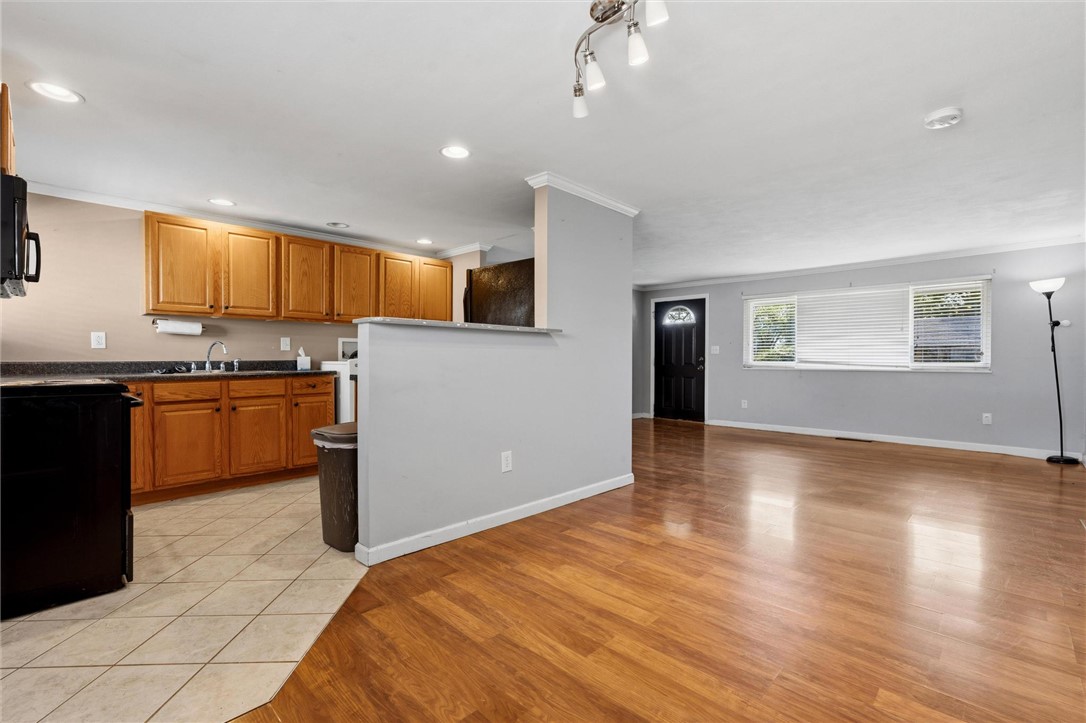 3890 Endover Road Dayton, OH 45439 - Photo 15 of 26 This open concept living space features a functional kitchen and inviting hardwood flooring.