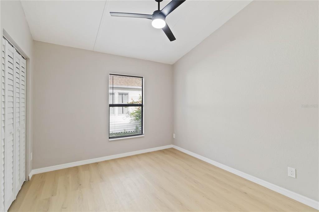 1368 21st Street Sarasota, FL 34234 - Photo 15 of 34 an empty room with windows and fan