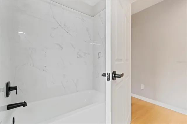 a bathroom with a double vanity sink a toilet and a window
