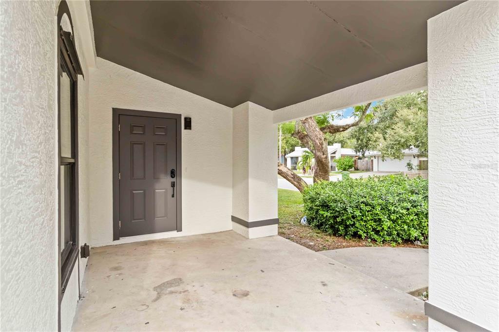 1368 21st Street Sarasota, FL 34234 - Photo 6 of 34 a view of a big room with wooden floor and garden